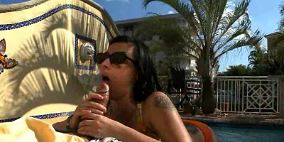Large breasts are getting handled by the guy by the pool outside