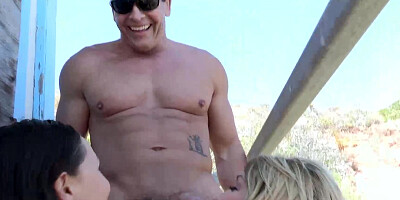 Surfer girls getting dicked by turns by the life guard in a threesome