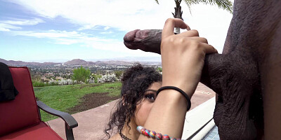 Jeni Angel is sucking the black monster cock by the pool