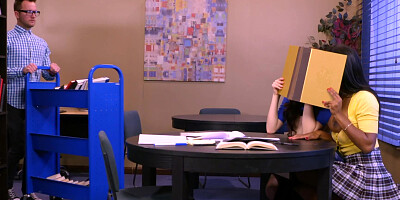 White and Ebony students make noise with nerd in the library