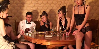 Teen jumps on the table and starts stripping to rock the party