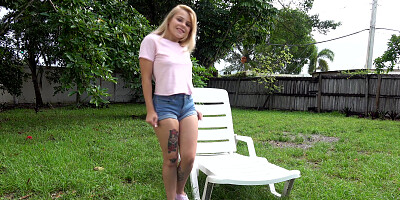 Petite Skylar Valentine fucks herself on a sun lounger