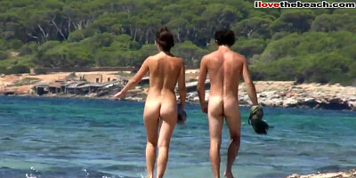 Entirely nude gals on a beach.