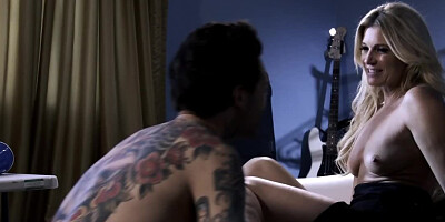 Tattooed rock musician and older woman devote time to foreplay