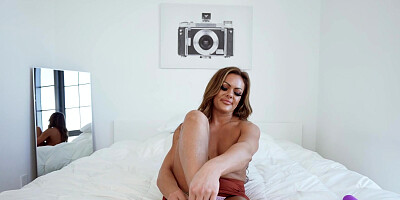 Aila Donovan plays with her favorite sex toy in bed