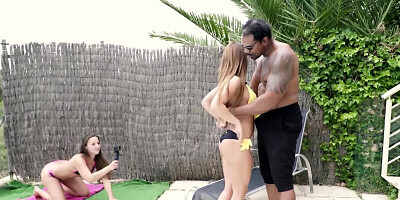 Tyra Moon rides a BBC by the pool in front of a camera