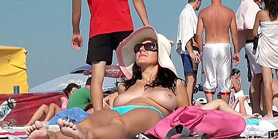 Hot Brunette with huge tits at beach