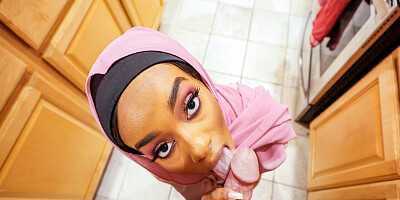 Lily Starfire on her knees sucking big cock