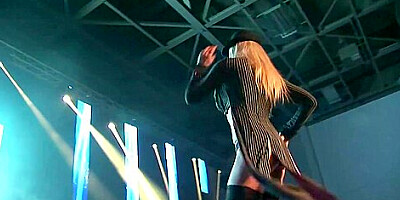 Busty milf stripping on public stage