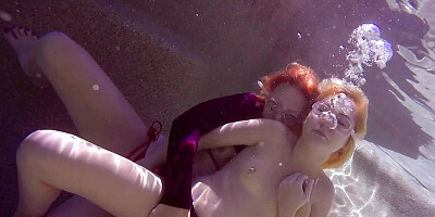 Pepper Kester and Odette Delacroix pleasuring each other under the water