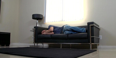 A redhead is sitting on top of her man on the sofa for some loving
