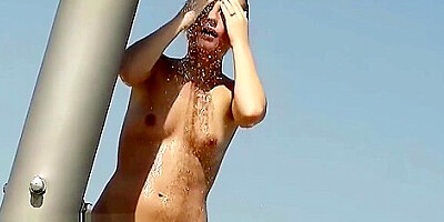 Superb beach video of a trimmed pussy tanning