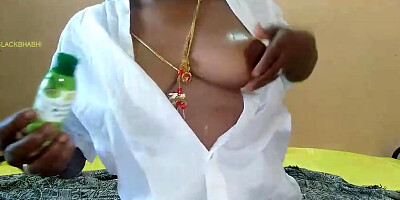 Hooded, African female is kneading her wooly poon in front of the web camera and lovin’ it