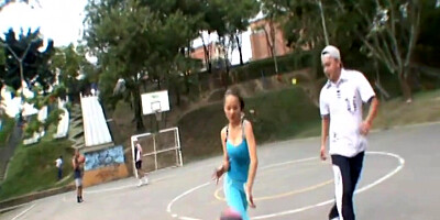 Paris Milan plays basketball outdoors