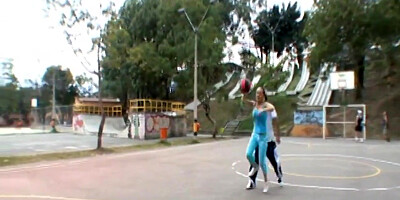 Paris Milan plays basketball outdoors