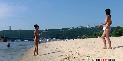 Bombastic young nudist babes sunbathe nude at the beach