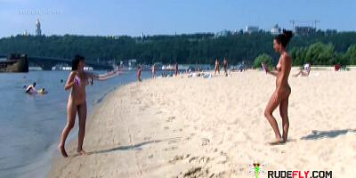 Bombastic young nudist babes sunbathe nude at the beach