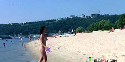 Bombastic young nudist babes sunbathe nude at the beach
