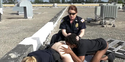 Busty female cops are fucking with black suspect on the roof