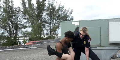 Busty female cops are fucking with black suspect on the roof