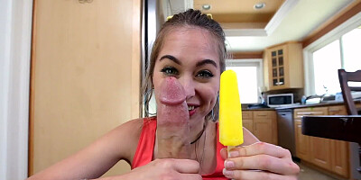Playful chick with a smile on her face eats an ice cream and semen
