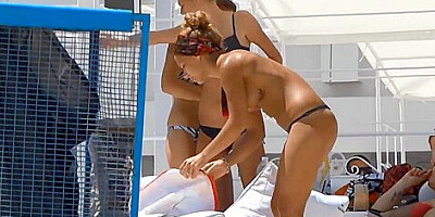 Voyeur porn compilation shows topless gals on the beach