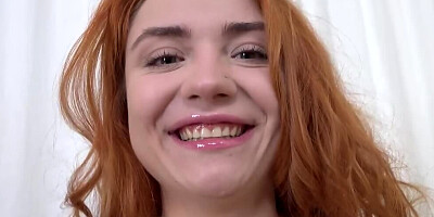 Naughty redhead facialized after intense sex on the couch