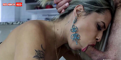 Whorish blondie honey with tats is providing a feetjob to a stud she luvs a bunch