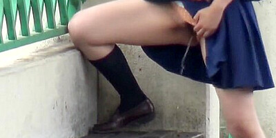 Asian pees on park bench
