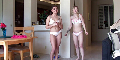Skinny babes playing a cute strip game in the living room