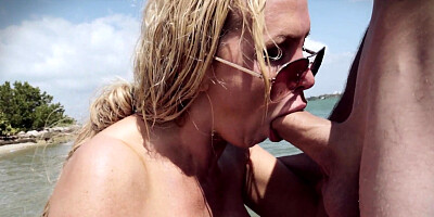 Nikki Benz takes a big cock down her throat & rides it hard on the beach