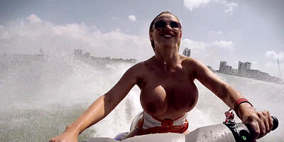Nikki Benz takes a big cock down her throat & rides it hard on the beach