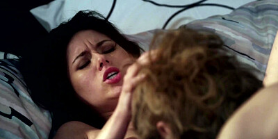 Two lesbian stepsisters are on the bed, naked and holding one another