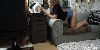 Nerdy woman with glasses is gargling her roomy's pipe while getting down on all fours in front of him
