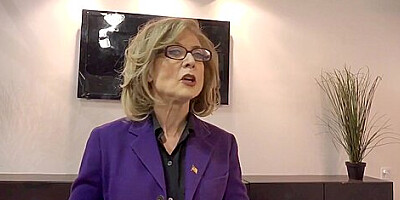 Nina Hartley knows how to handle two black dicks at the same time, in the conference room