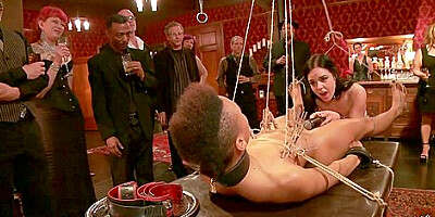 Nikki Darling In Ebony Slave Holding Heavy Padlocks