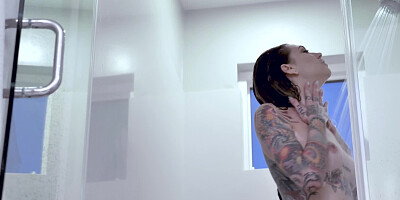 Inked cutie takes a sexy shower and shows off