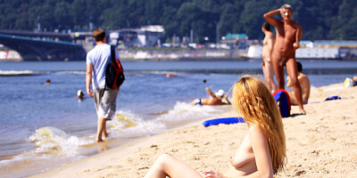 Nude beach girl is having a great time 2