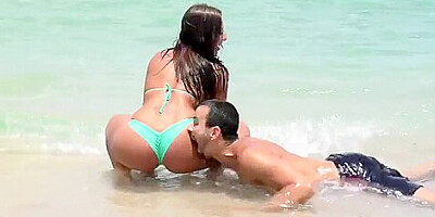 Sexy and young couple spend time near the water in beautiful place