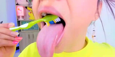 Lila Jordan is brushing her tongue in front of the camera, because it looks beautiful