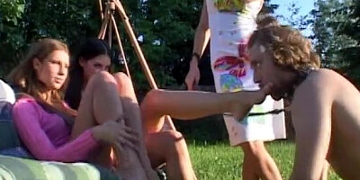 Leashed slave licking mistresses bare feet after a pony play outdoors