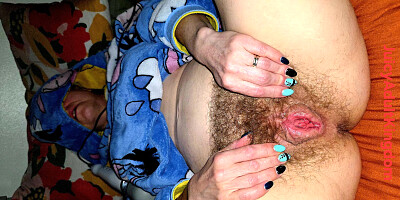 Before bed time, the wife masturbates using a magic wand