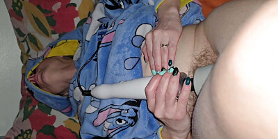 Before bed time, the wife masturbates using a magic wand