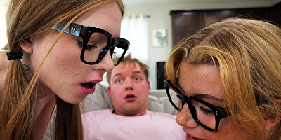 Myra Moans and Stella Luxx in glasses are sucking cock