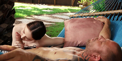 Hazel Moore pleasuring tattooed guy outdoors