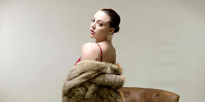 Wealthy young lady relaxes masturbating pussy in the armchair