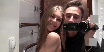 A hot lovely lady pushes her boobs together and she also smiles