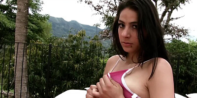 Brunette girl Santa Catalina rubs her nice wet pussy in the yard