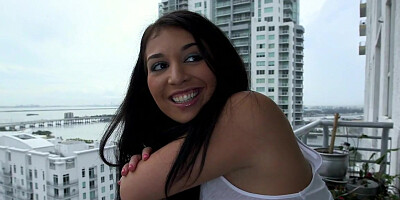 Petite brunette is kneeling and sucking