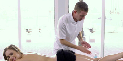 A blonde is caught naked on the massage table as she is getting touched